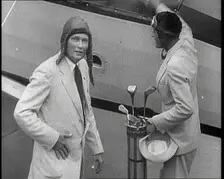 Two Golfers With Gold Clubs Enter a Gyrocopter, 1932. Creator: British Pathe Ltd