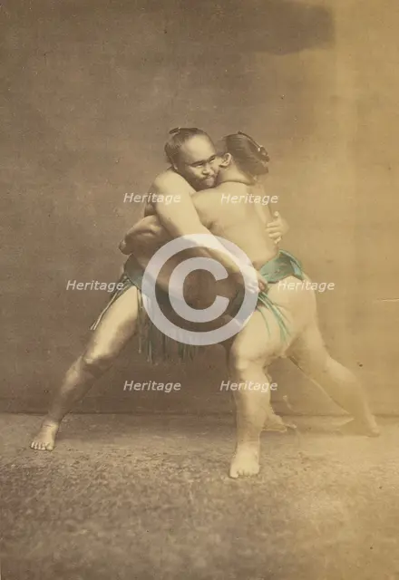 Two Japanese sumo westlers in gappling pose, 1868-1880. Creator: Felice Beato.