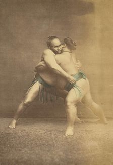 Two Japanese sumo westlers in gappling pose, 1868-1880. Creator: Felice Beato