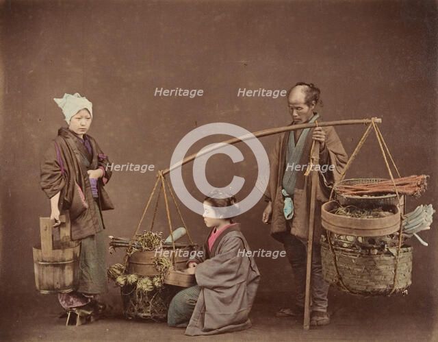 Two Japanese Women and One Japanese Man Posing with Water Bucket and Baskets], 1870s. Creator: Unknown.