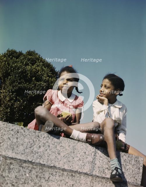 Two little girls in a park near Union Station, Washington, D.C., ca. 1943. Creator: Unknown.