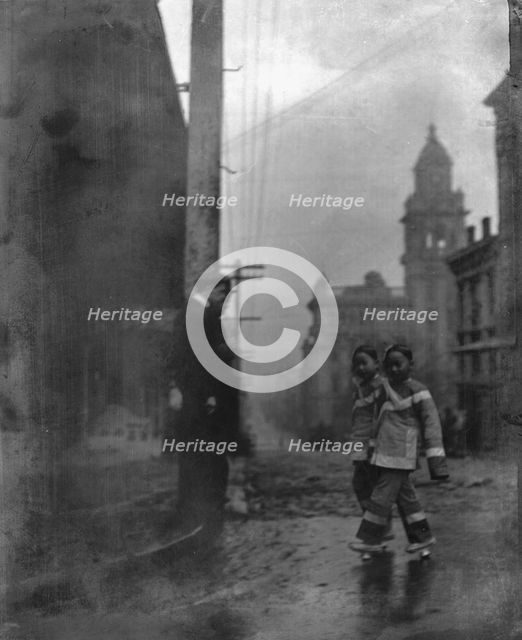 Two little maids from school, Chinatown, San Francisco, between 1896 and 1906. Creator: Arnold Genthe.