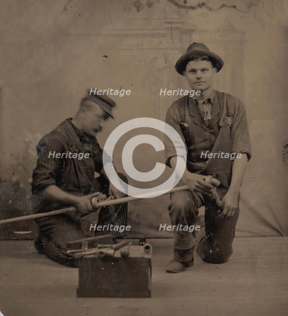 Two Plumbers with a Pipe, Pipe Cutter, and Toolbox, 1870s-80s. Creator: Unknown.