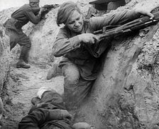 Two Russian Soldiers Taking Cover in a Trench, 1941. Creator: British Pathe Ltd