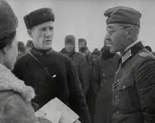 Two Russian Soldiers Talking to a German Prisoner of War, 1941. Creator: British Pathe Ltd