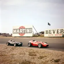 Two racing cars taking a bend, Dutch Grand Prix, Zandvoort, Holland, 1959