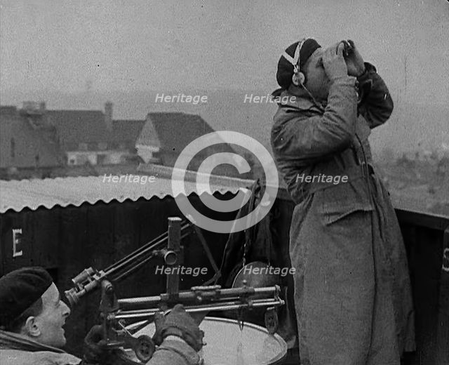Two Royal Observer Corps Members in a Lookout Post, 1940. Creator: British Pathe Ltd.