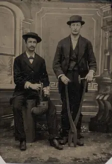 Two Stovepipe Makers, One with a Hammer and Tin Snips..., 1880s. Creator: Unknown