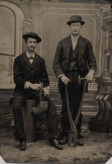 Two Stovepipe Makers, One with a Hammer and Tin Snips..., 1880s. Creator: Unknown