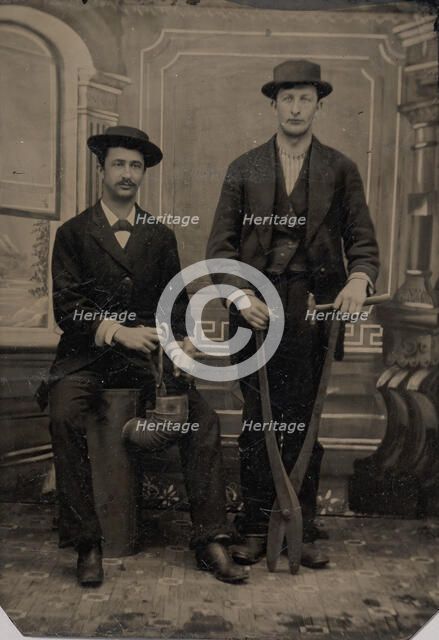 Two Stovepipe Makers, One with a Hammer and Tin Snips..., 1880s. Creator: Unknown.