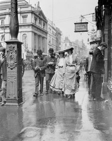 Two suffragettes walking along a pavement, London, 1900s. Creator: Unknown