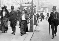 Two suffragettes with Herbert Asquith, c1910. Creator: Unknown