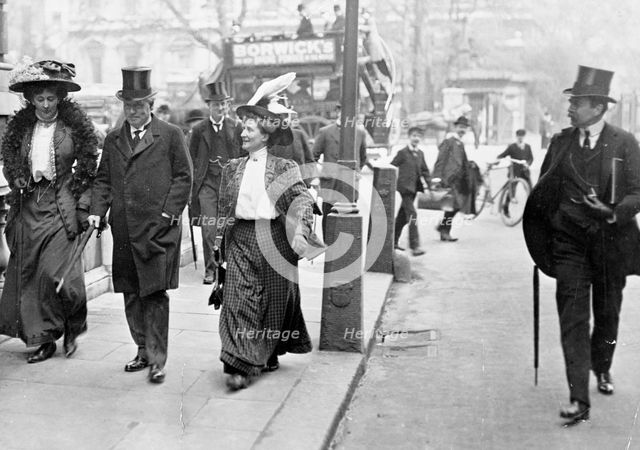 Two suffragettes with Herbert Asquith, c1910. Creator: Unknown.