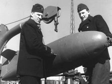 Two sailors with a torpedo, Sweden, 1955