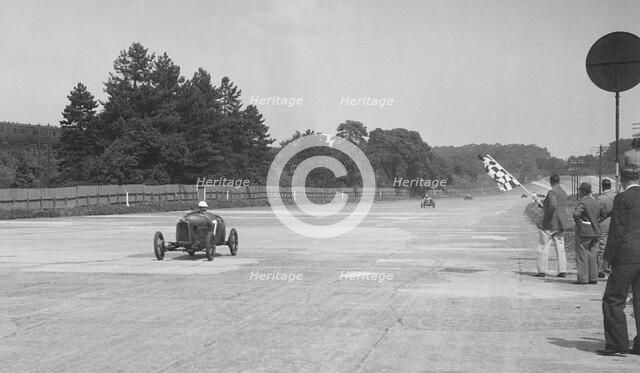 Two Salmson cars taking the chequered flag at Brooklands. Artist: Bill Brunell.
