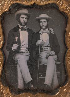Two Seated Young Men Holding Ivory-topped Walking Sticks, 1850s. Creator: Unknown