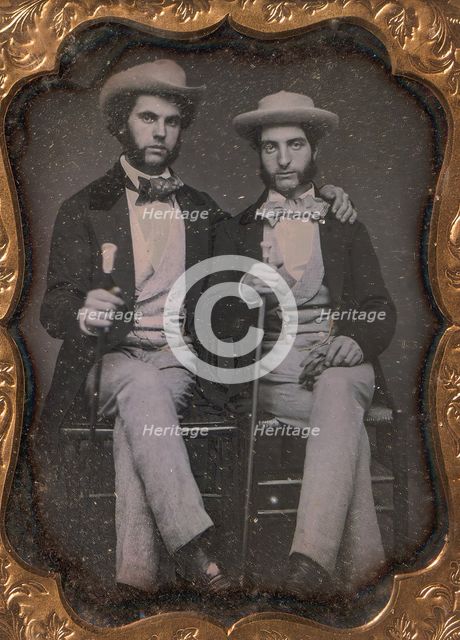 Two Seated Young Men Holding Ivory-topped Walking Sticks, 1850s. Creator: Unknown.