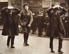 Two Sinn Fein members arrested by British troops, Dublin, Ireland, 1920. Creator: Unknown