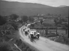 Two Singer Le Mans cars competing in the RSAC Scottish Rally, 1936. Artist: Bill Brunell