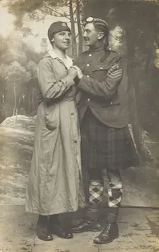 Two soldiers playing in a military concert party embrace: one is in drag and the ..., [1910-1919]. Creator: Unknown