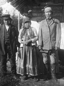 Two Tungus men and a woman with a cross on her chest, 1920-1939. Creator: Unknown