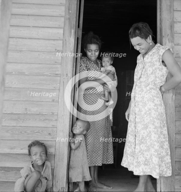Two tobacco tenant mothers (related) with part of their children, Wake County, North Carolina, 1939. Creator: Dorothea Lange.