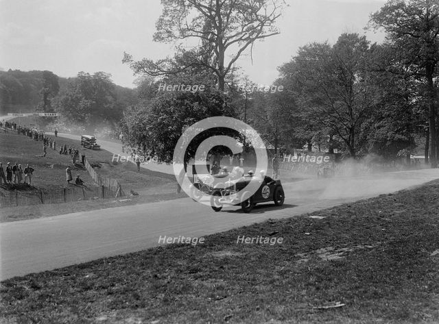 Two Wolseleys racing, Donington Park Race Meeting, Leicestershire, 1933. Artist: Bill Brunell.