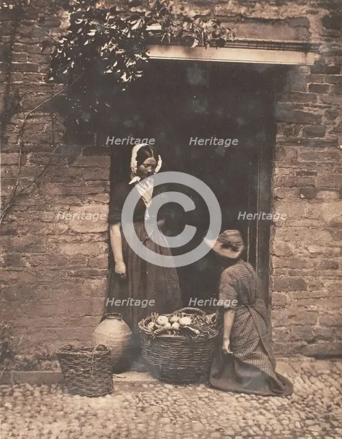 [Two Women, One Kneeling and One Standing, Looking into Basket Filled with Vegetables], 1853-56. Creator: John Dillwyn Llewelyn.