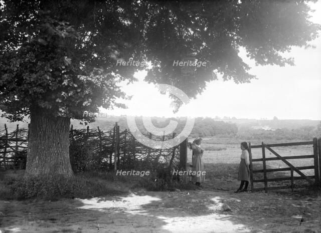 Two women at a gate, Open Brasnose, Horspath, Oxfordshire, c1860-c1922. Artist: Henry Taunt