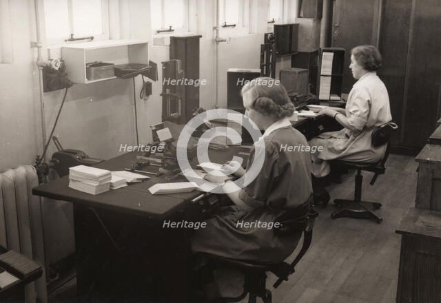 Two women at work in the wages office, Rowntree factory, York, Yorkshire, 1952. Artist: Unknown