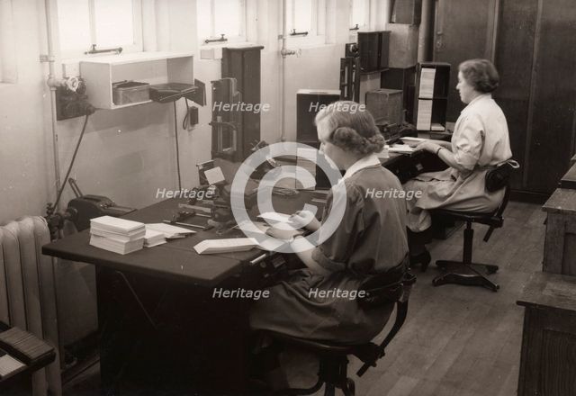 Two women at work in the wages office, Rowntree factory, York, Yorkshire, 1952. Artist: Unknown