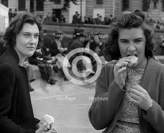Two Women Eating in Trafalgar Square, 1940. Creator: British Pathe Ltd.