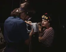 Two women employees of North American Aviation, Incorporated, assembling a section of a..., 1942. Creator: Alfred T Palmer