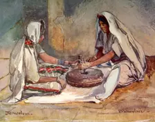 Two Women Grinding at a Hand Mill 1902. Creator: John Fulleylove