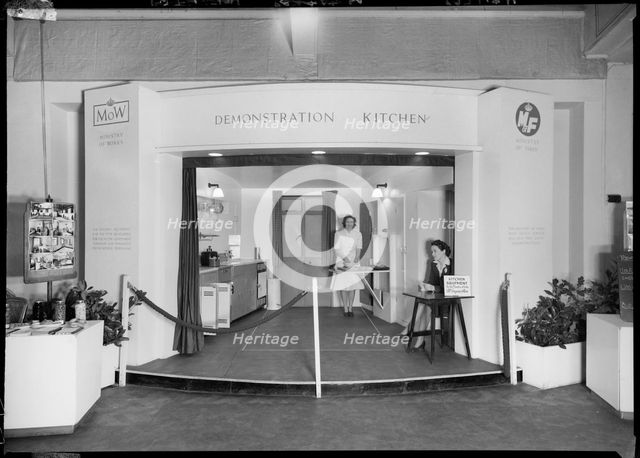 Two women in a demonstration kitchen, 1946. Creator: Ministry of Works.