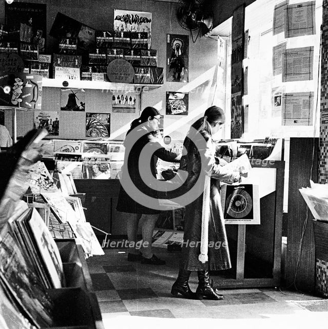 Two women in a London record store, c1960s. Creator: Henry Grant.