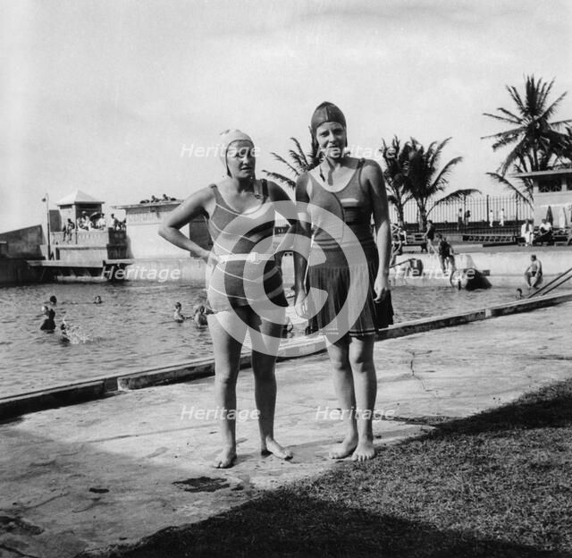 Two women in swimsuits beside a swimming pool, Balboa, Panama, 1931. Artist: Unknown