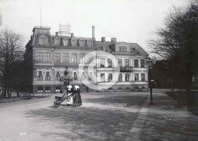 Two women with a wheelbarrow on their way to the fish market, Landskrona, Sweden, 1900. Artist: Borg Mesch