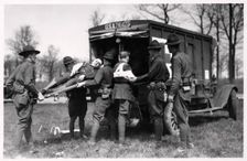 Two wounded soldiers being helped into an ambulance, Fort Sheridan, Illinois, USA, 1930
