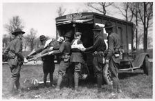 Two wounded soldiers being helped into an ambulance, Fort Sheridan, Illinois, USA, 1930