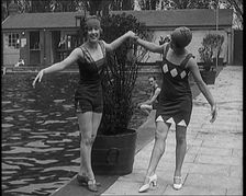 Two Young Female Civilians Wearing Short Swimsuits and Heeled Shoes Posing for the Camera..., 1920. Creator: British Pathe Ltd