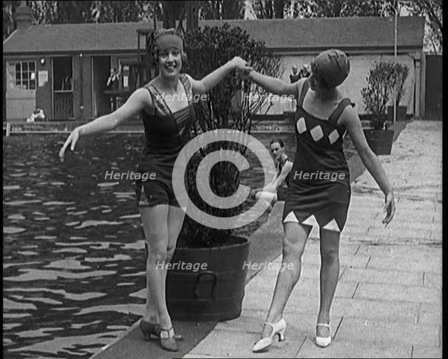 Two Young Female Civilians Wearing Short Swimsuits and Heeled Shoes Posing for the Camera..., 1920. Creator: British Pathe Ltd.