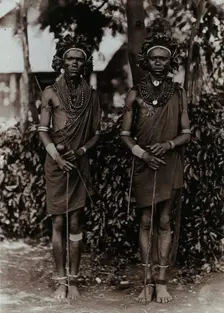 Two young Kikuyu men, carrying sticks, c1900. Creator: Unknown