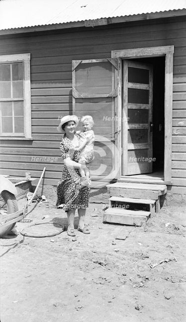 Typical Teutonic farm wife and child of Mills, New Mexico, area, 1935. Creator: Dorothea Lange.