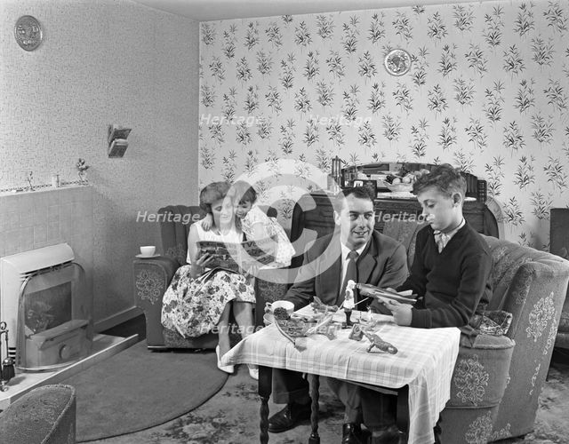 Typical working class living room scene with family, 11 July 1962. Creator: Michael Walters.
