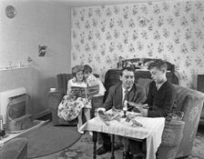 Typical working class living room scene with family, 11 July 1962. Creator: Michael Walters