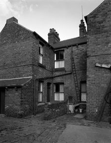 Typical pit housing in Furlong Road, Bolton upon Dearne, South Yorkshire, 1963. Creator: Michael Walters