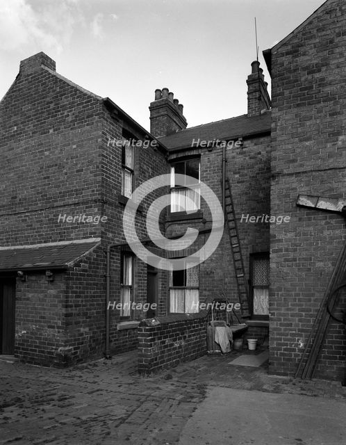 Typical pit housing in Furlong Road, Bolton upon Dearne, South Yorkshire, 1963.  Creator: Michael Walters.