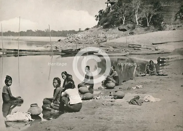 'Typical Riverside Scene on the great Irrawaddy - Women bathing and drawing water', 1900. Creator: Unknown.