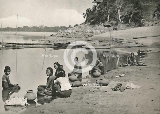 'Typical Riverside Scene on the great Irrawaddy - Women bathing and drawing water', 1900. Creator: Unknown.